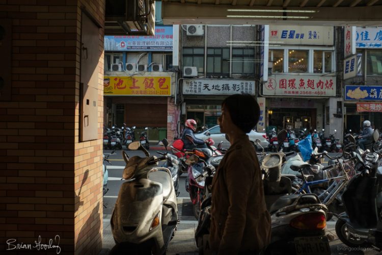 Wandering around Taipei trying to keep my head straight. I ducked in a convenience store to escape the heat and get a snack. Staring out window, a slice of reality simplified, bisected in front of me. It never stops moving.